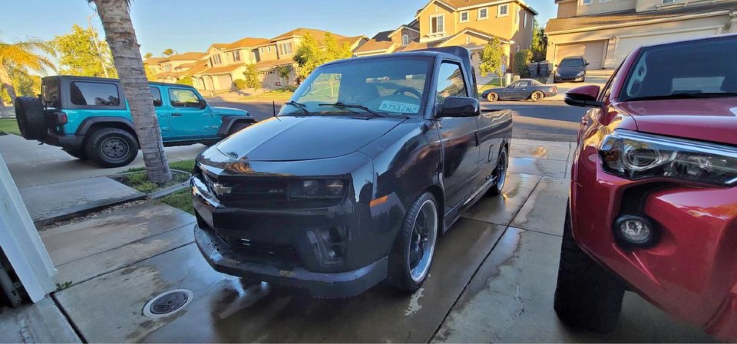 Bizarre Chevy Astro Van Customized With Camaro Front End