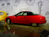 1997-gm-ev1-red-petersen-automotive-museum-exterior-002-side-profile