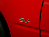 1997-gm-ev1-red-petersen-automotive-museum-exterior-004-badge