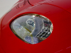 1997-gm-ev1-red-petersen-automotive-museum-exterior-005-head-light