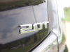 2-0t-badge-on-liftgate-of-2019-cadillac-xt4-sport-exterior-in-stellar-black-metallic-at-cadillac-event-001