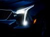 2019-cadillac-xt4-sport-exterior-dusk-011-headlight-with-full-forward-light-and-turn-light-gma-garage