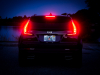 2019-cadillac-xt4-sport-exterior-dusk-017-rear-end-with-tail-lights-and-brake-lights-gma-garage