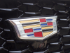 cadillac-logo-on-grille-of-2019-cadillac-xt4-sport-exterior-in-stellar-black-metallic-at-cadillac-event-002