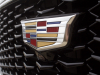 cadillac-logo-on-grille-of-2019-cadillac-xt4-sport-exterior-in-stellar-black-metallic-at-cadillac-event-005
