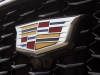 cadillac-logo-on-grille-of-2019-cadillac-xt4-sport-exterior-in-stellar-black-metallic-at-cadillac-event-008