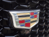 cadillac-logo-on-grille-of-2019-cadillac-xt4-sport-exterior-in-stellar-black-metallic-at-cadillac-event-014
