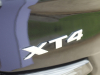 cadillac-xt4-logo-badge-on-2019-cadillac-xt4-sport-exterior-in-stellar-black-metallic-at-cadillac-event-002