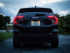 2019-gmc-terrain-exterior-at-dusk-007-rear-end-with-tail-lamps-on