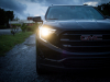 2019-gmc-terrain-exterior-at-dusk-012-front-end-with-headlights-on