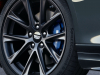 2022-cadillac-ct4-v-first-drive-exterior-028-front-wheel-cadillac-logo-on-wheel-cap-blue-v-brake-caliper