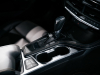 2020-cadillac-ct4-sport-sedan-interior-008-center-console-shifter-cupholders-armrest