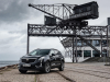 2020-cadillac-xt5-sport-in-denmark-with-russian-license-plates-exterior-005-black-front-three-quarters-on-ship-yard