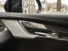 2020-cadillac-xt5-sport-interior-022-front-passenger-door-panel-bose-performance-series-speaker-grille-treatment-carbon-fiber-decor