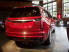 2020-cadillac-xt6-sport-with-platinum-package-red-horizon-tintcoat-xt6-first-drive-lobby-004-rear-three-quarters