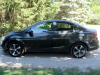 2020-chevrolet-sonic-premier-sedan-rental-exterior-014-side-profile
