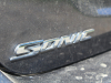 2020-chevrolet-sonic-premier-sedan-rental-exterior-029-sonic-logo-badge