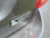 2020-chevrolet-sonic-premier-sedan-rental-exterior-034-premier-logo-badge