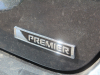 2020-chevrolet-sonic-premier-sedan-rental-exterior-035-premier-logo-badge