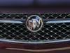 2021-buick-envision-avenir-rich-garnet-metallic-exterior-005-front-end-grille-buick-logo-badge