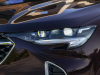 2021-buick-envision-avenir-rich-garnet-metallic-exterior-010-front-end-headlight