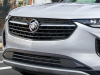 2021-buick-envision-st-sport-touring-package-summit-white-real-world-exterior-004-front-end-grille-buick-logo