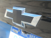 2022-chevrolet-bolt-euv-first-drive-exterior-bright-blue-metallic-019-black-chevrolet-logo-bow-tie-rear