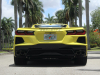 2021-chevrolet-corvette-stingray-coupe-3lt-accelerate-yellow-metallic-gma-garage-exterior-044-rear-low-angle