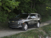 2021-chevrolet-tahoe-high-country-graywood-metallic-gs6-press-photos-exterior-006-side-front-three-quarters