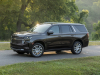 2021-chevrolet-tahoe-high-country-graywood-metallic-gs6-press-photos-exterior-008-side-front-three-quarters