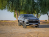 2021-chevrolet-tahoe-z71-middle-east-exterior-010-front-three-quarters-dirt-road