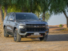 2021-chevrolet-tahoe-z71-middle-east-exterior-011-front-three-quarters-dirt-road