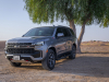 2021-chevrolet-tahoe-z71-middle-east-exterior-013-front-three-quarters-dirt-road