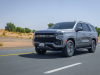 2021-chevrolet-tahoe-z71-middle-east-exterior-026-front-three-quarters-road