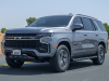 2021-chevrolet-tahoe-z71-middle-east-exterior-027-front-three-quarters-road