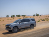 2021-chevrolet-tahoe-z71-middle-east-exterior-030-front-three-quarters-dirt