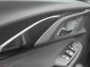 2021-chevrolet-trailblazer-rs-gma-garage-interior-door-panels-003-driver-door-piano-black-trim-door-release