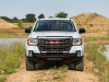 2021-gmc-canyon-at4-off-road-performance-edition-exterior-019-front-end-grille-gmc-logo-red-tow-hooks