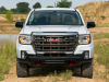 2021-gmc-canyon-at4-off-road-performance-edition-exterior-020-front-end-grille-gmc-logo-red-tow-hooks