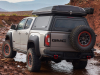2021-gmc-canyon-at4-ovrlandx-concept-manufacturer-photos-exterior-007-rear-three-quarters-offset-gmc-logo-full-size-spare-17-inch-aev-crestone-beadlock-wheel-with-bf-goodrich-tire