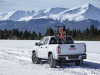 2021-gmc-canyon-at4-exterior-004-rear-three-quarters-in-snow-with-bike