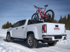 2021-gmc-canyon-at4-exterior-005-rear-three-quarters-in-snow-with-bike