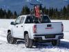 2021-gmc-canyon-at4-exterior-012-rear-three-quarters-in-snow-with-bike
