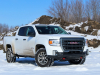 2021-gmc-canyon-at4-summit-white-crew-cab-short-bed-gma-garage-exterior-004-front-three-quarters-snow