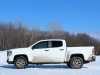 2021-gmc-canyon-at4-summit-white-crew-cab-short-bed-gma-garage-exterior-006-side-profile-snow