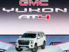 2021-gmc-yukon-at4-live-reveal-exterior-006-front-three-quarters-on-stage
