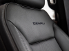 2021-gmc-yukon-xl-denali-interior-011-cockpit-denali-logo-on-front-seat