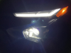 2022-chevrolet-bolt-ev-gma-garage-headlights-at-night-exterior-003-daytime-running-lights-and-primary-headlights