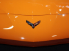 2023-chevrolet-corvette-c8-z06-convertible-3lz-amplify-orange-sema-2021-exterior-010-carbon-flash-corvette-logo-badge-at-front