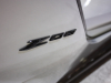 2023-chevrolet-corvette-c8-z06-coupe-3lz-silver-flare-metallic-roof-off-sema-2021-exterior-023-z06-badge-logo